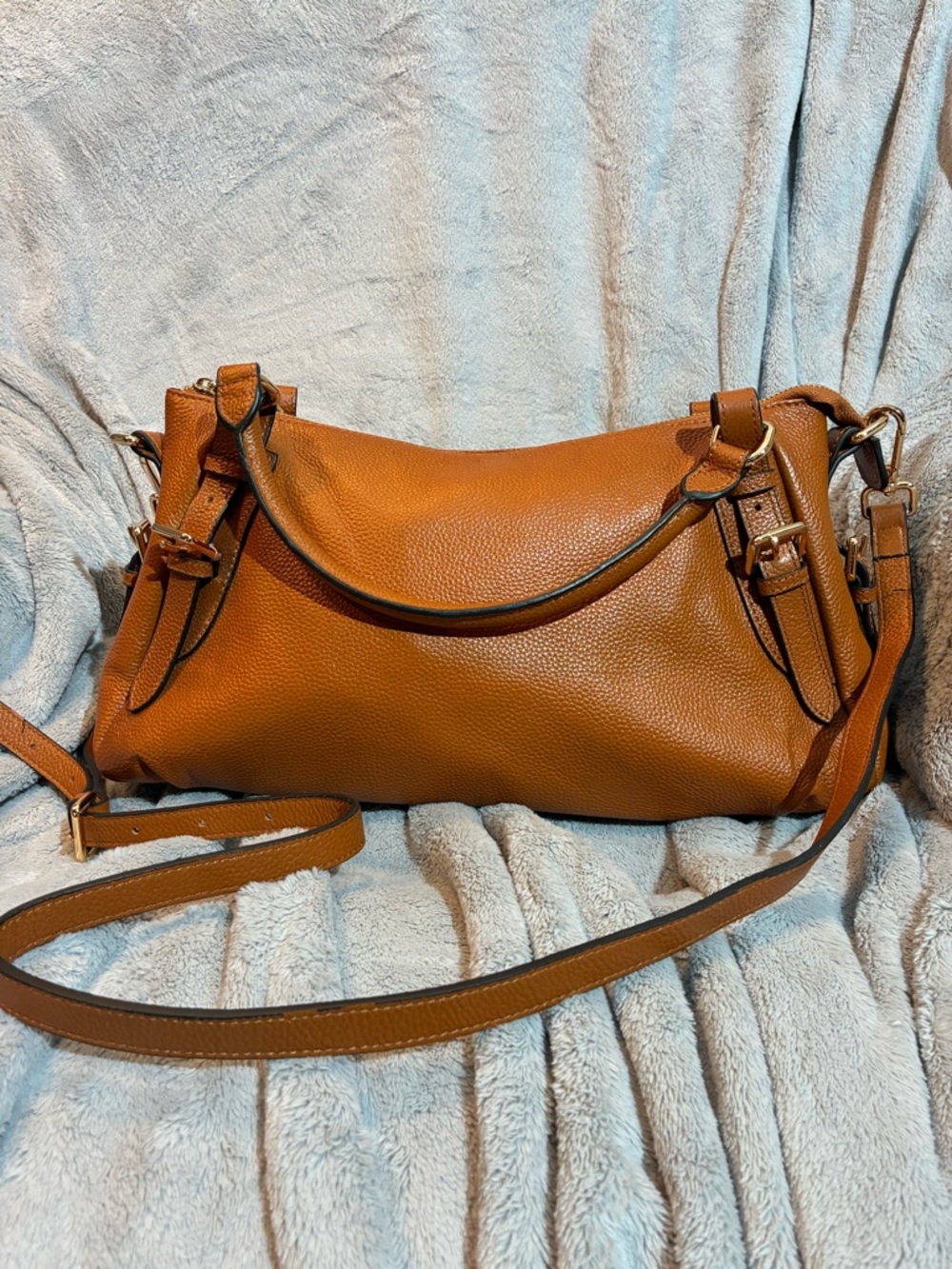 Brown leather hobo bag by the brand Kattee